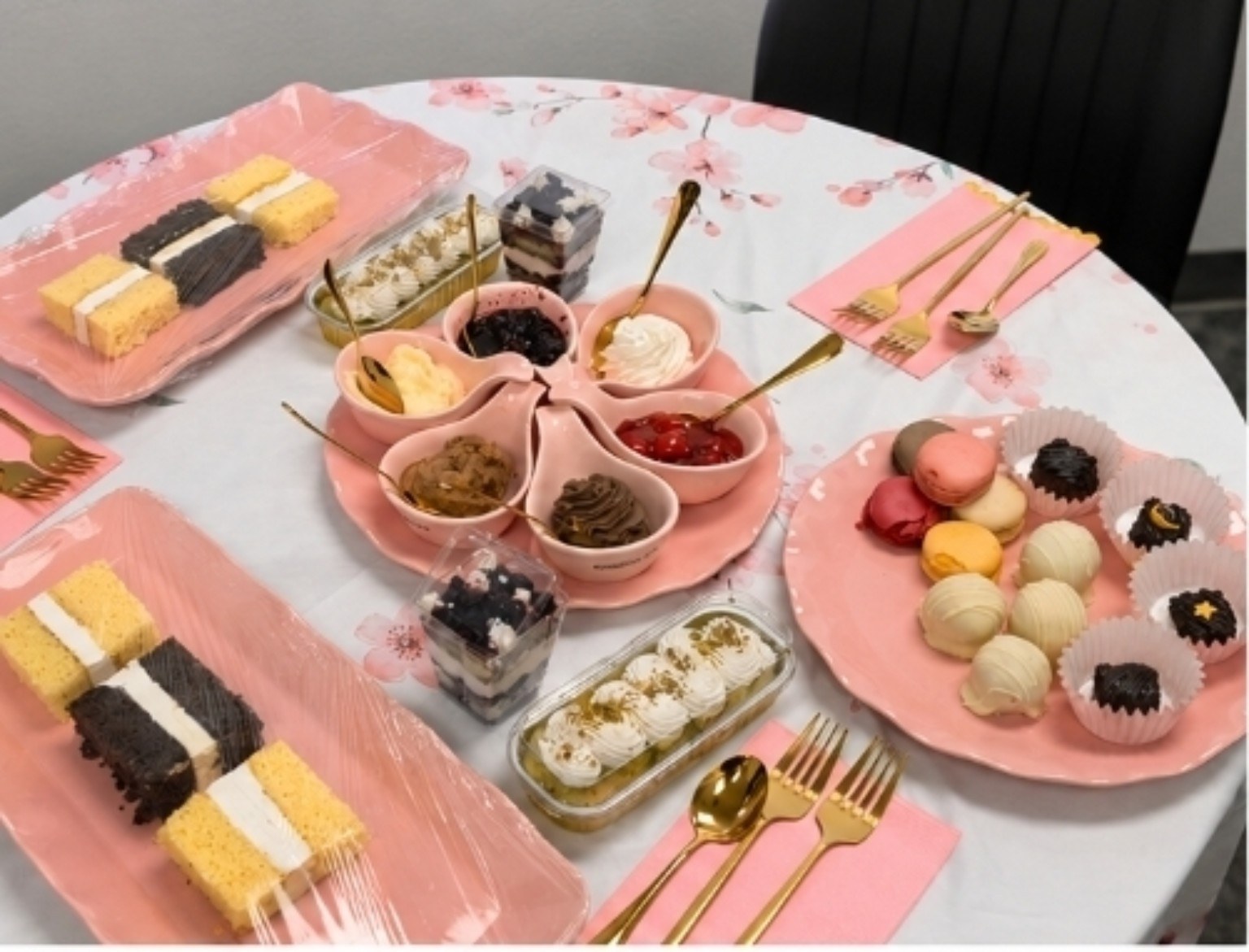 Baby Girl Bakes tasting suite table with cake slices, fillings and desserts